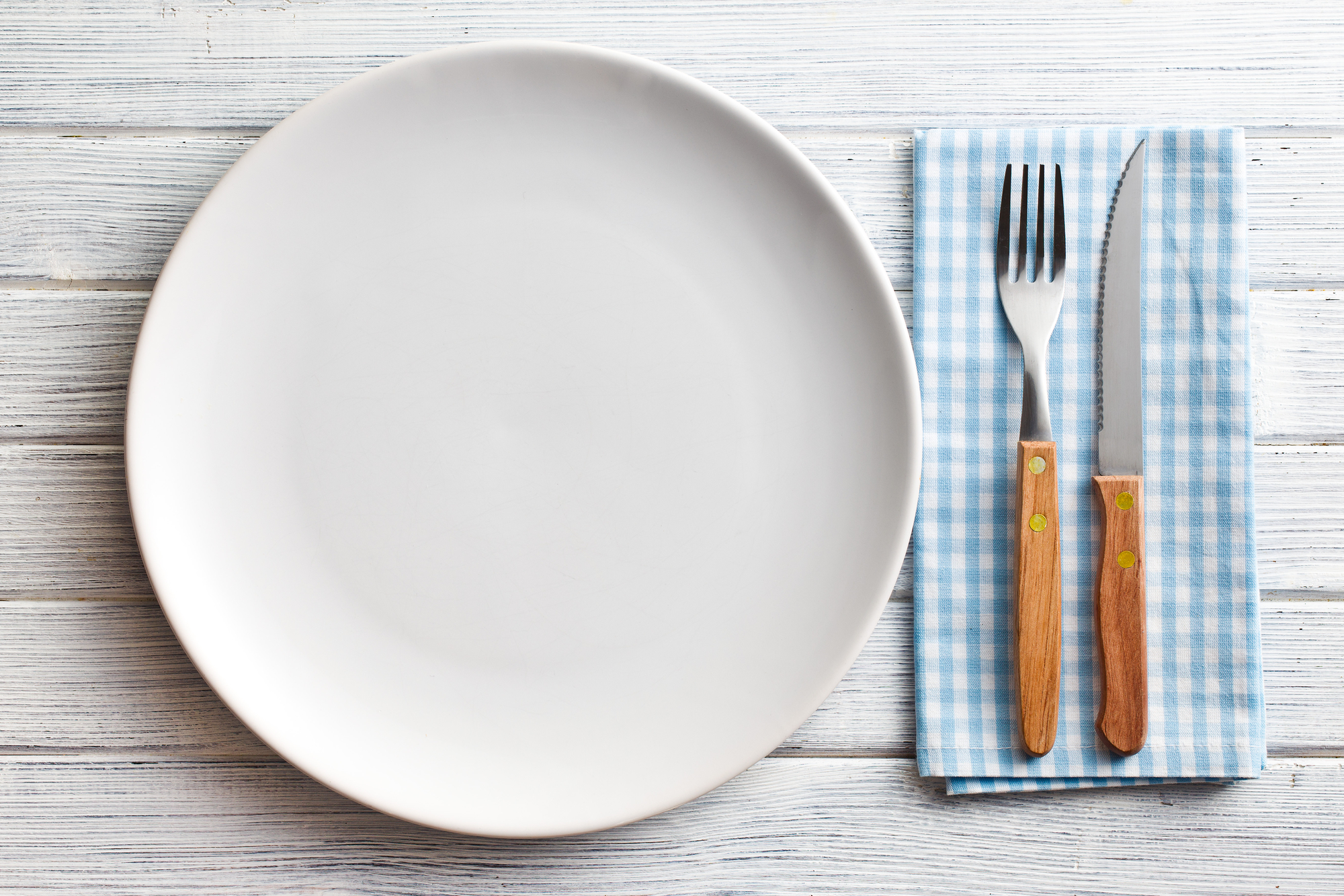 the white plate with fork and knife